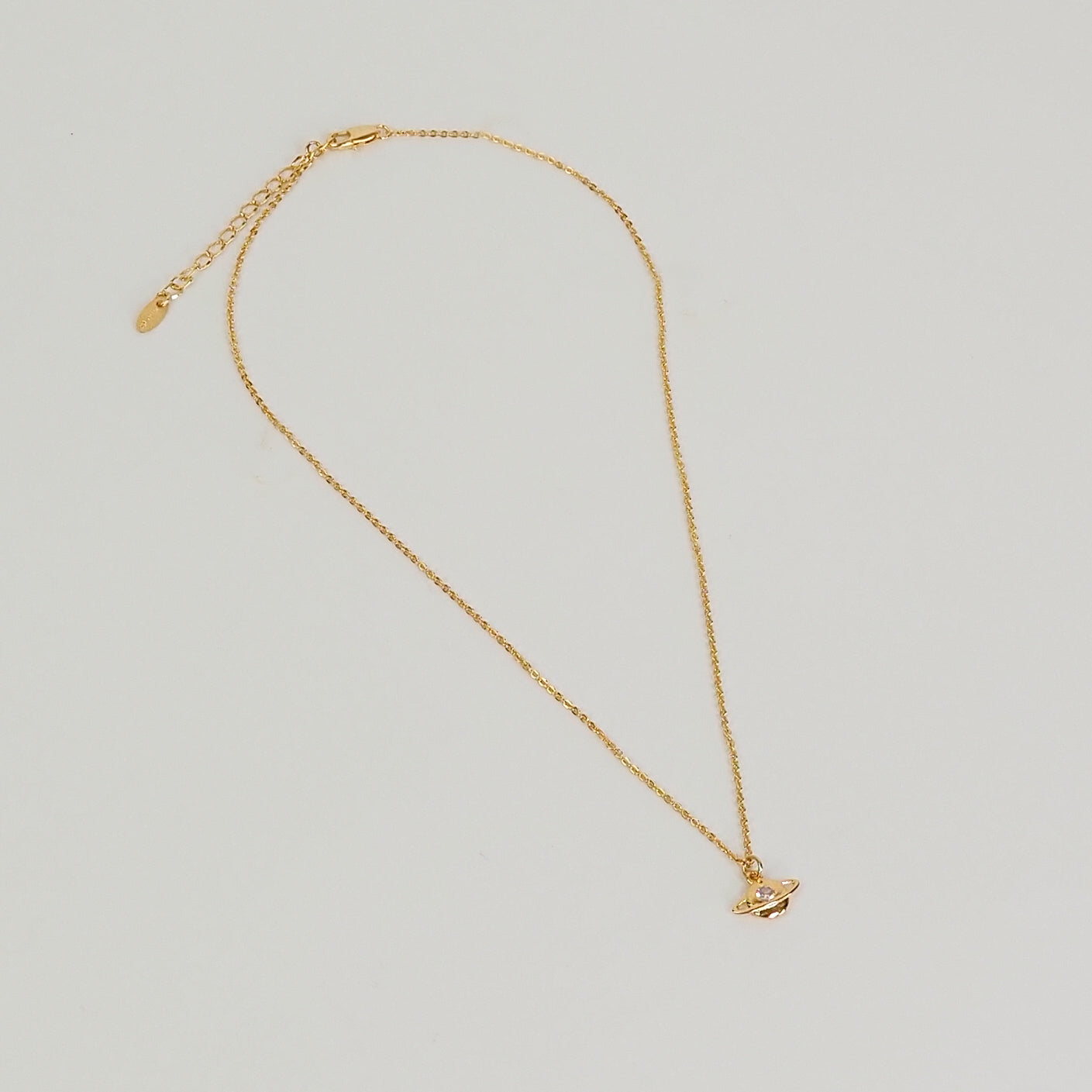 Colar planeta dourado