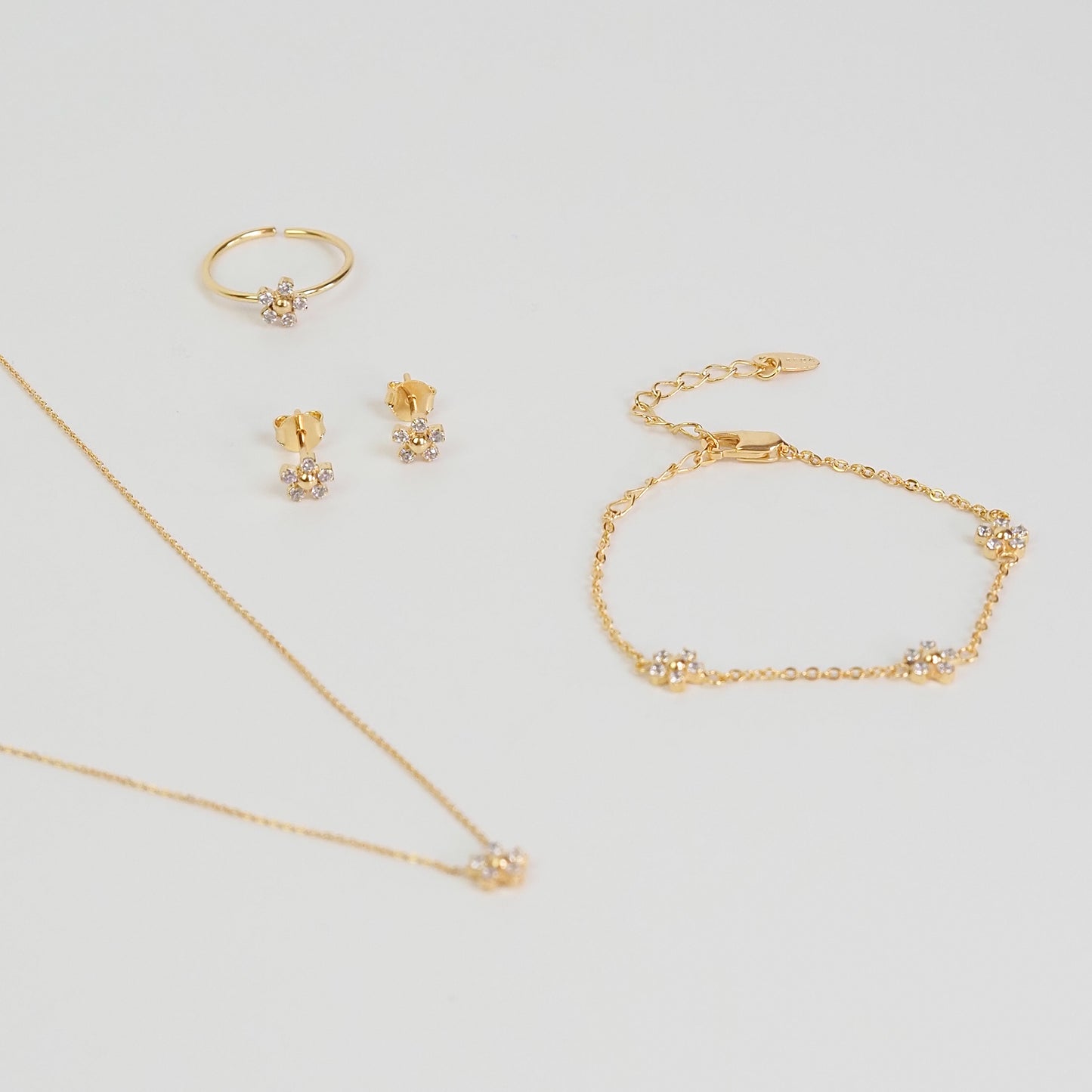 Anel flor zirconia dourado