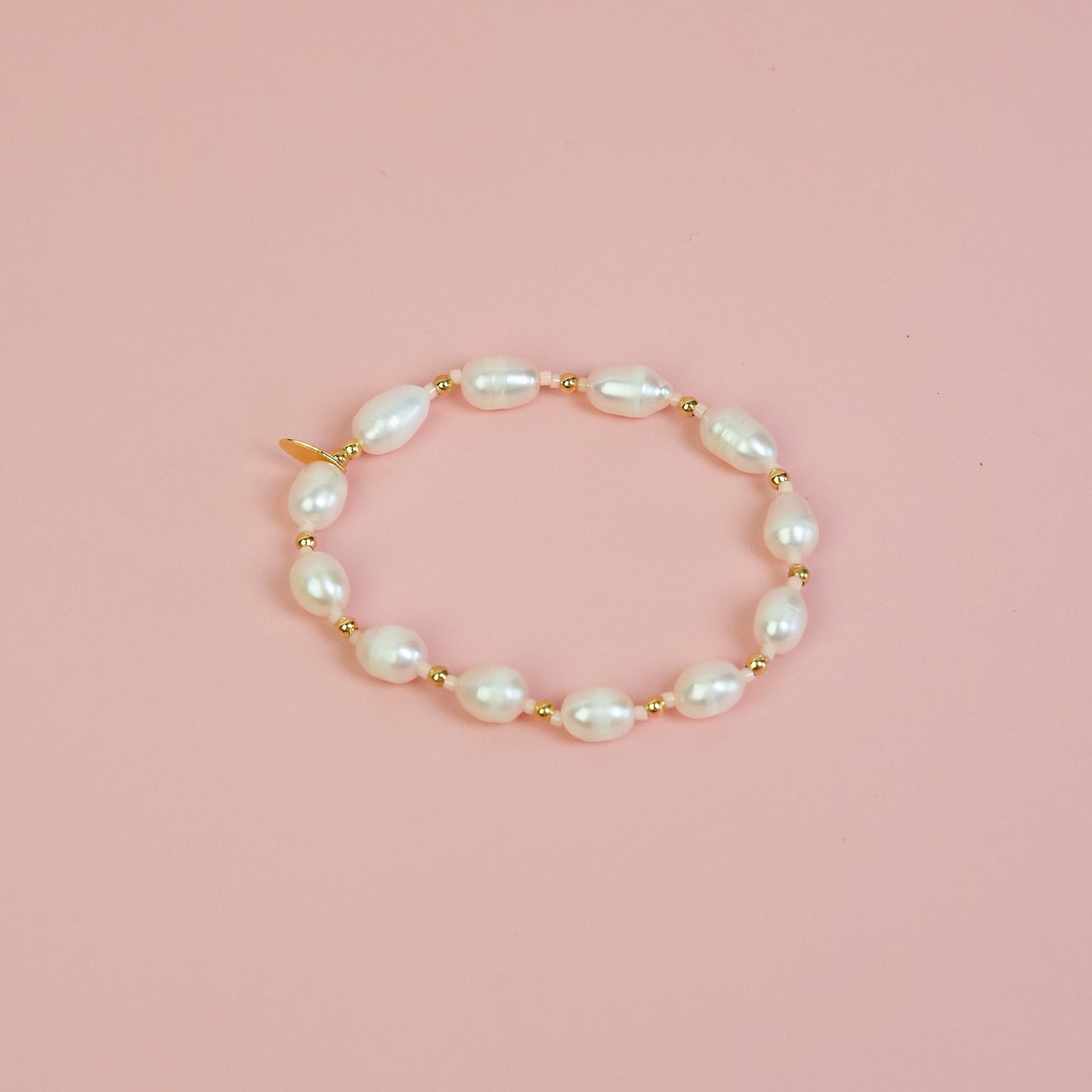 Pulseira pérola pêssego dourada