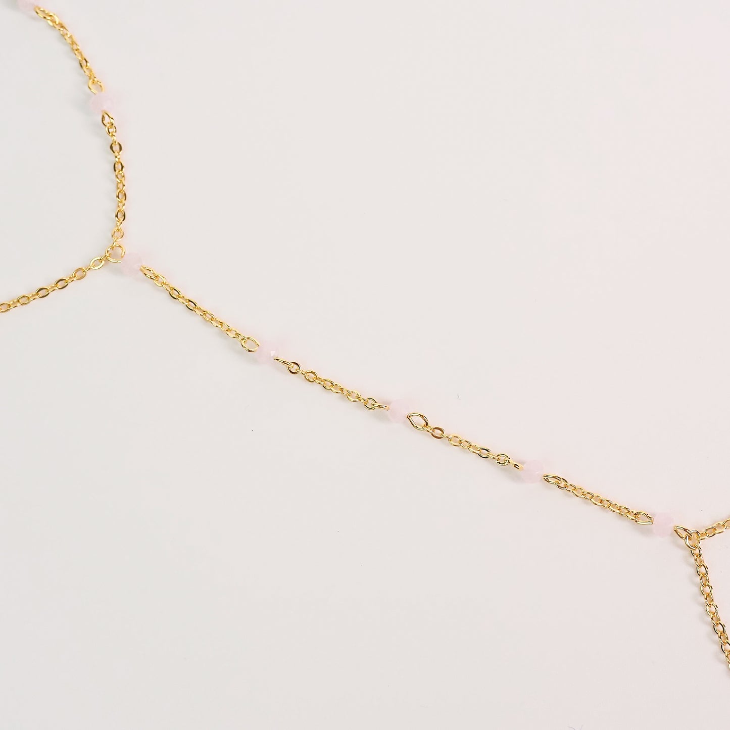 Handchain pedrinhas rosa dourado