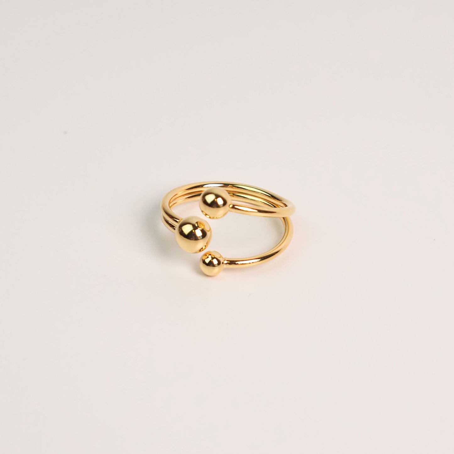 Anel três bolinhas ajustável dourado
