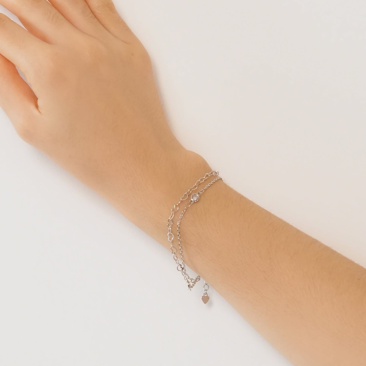 Pulseira dupla corações prateada