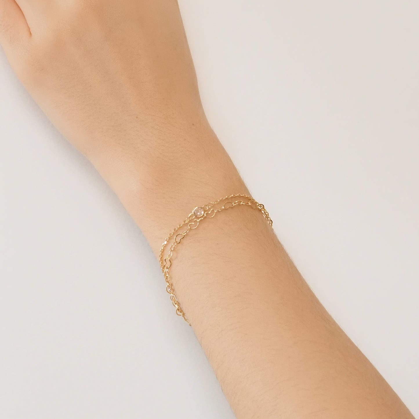 Pulseira dupla corações dourada