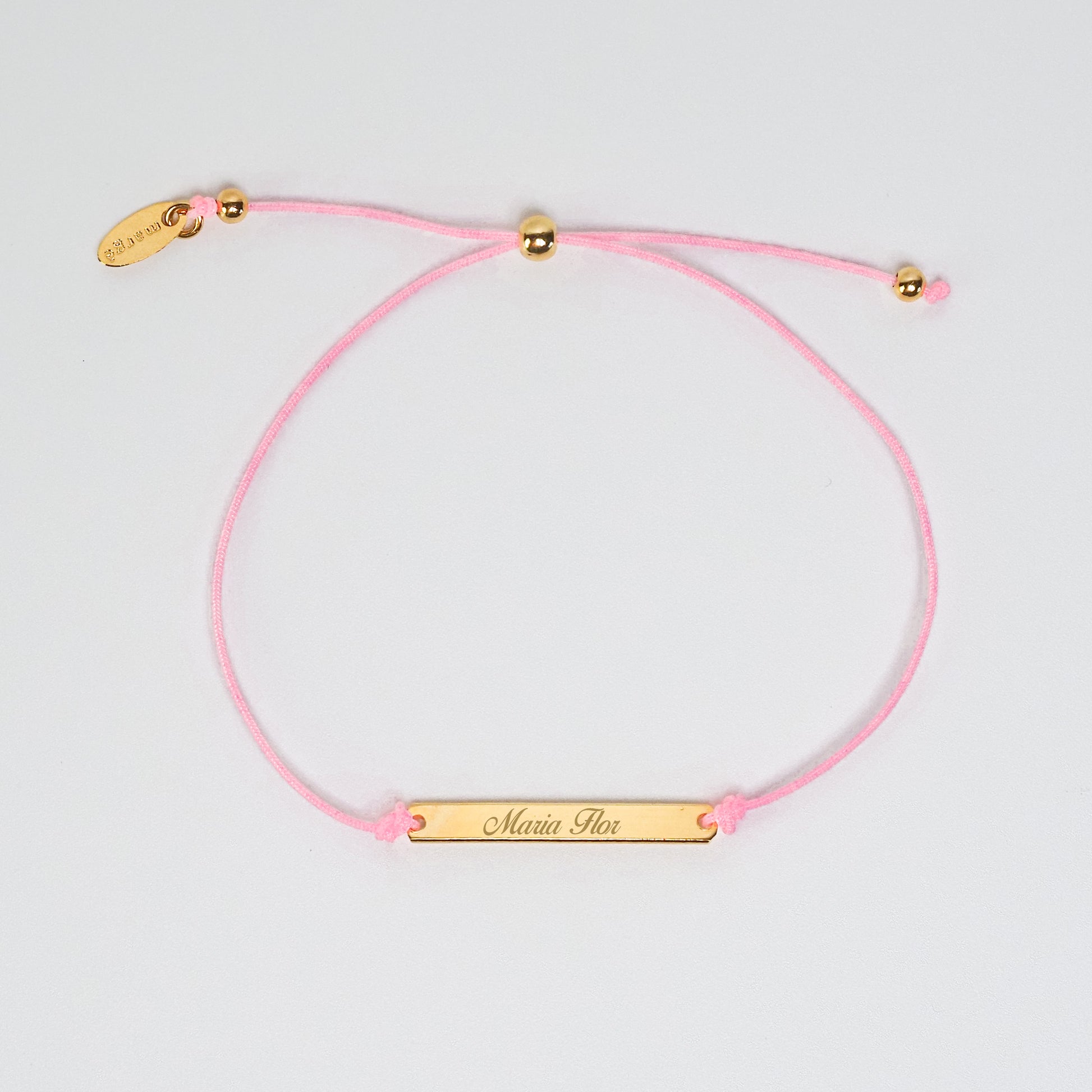 Pulseira inicial plaquinha rosa dourada - margê atelier