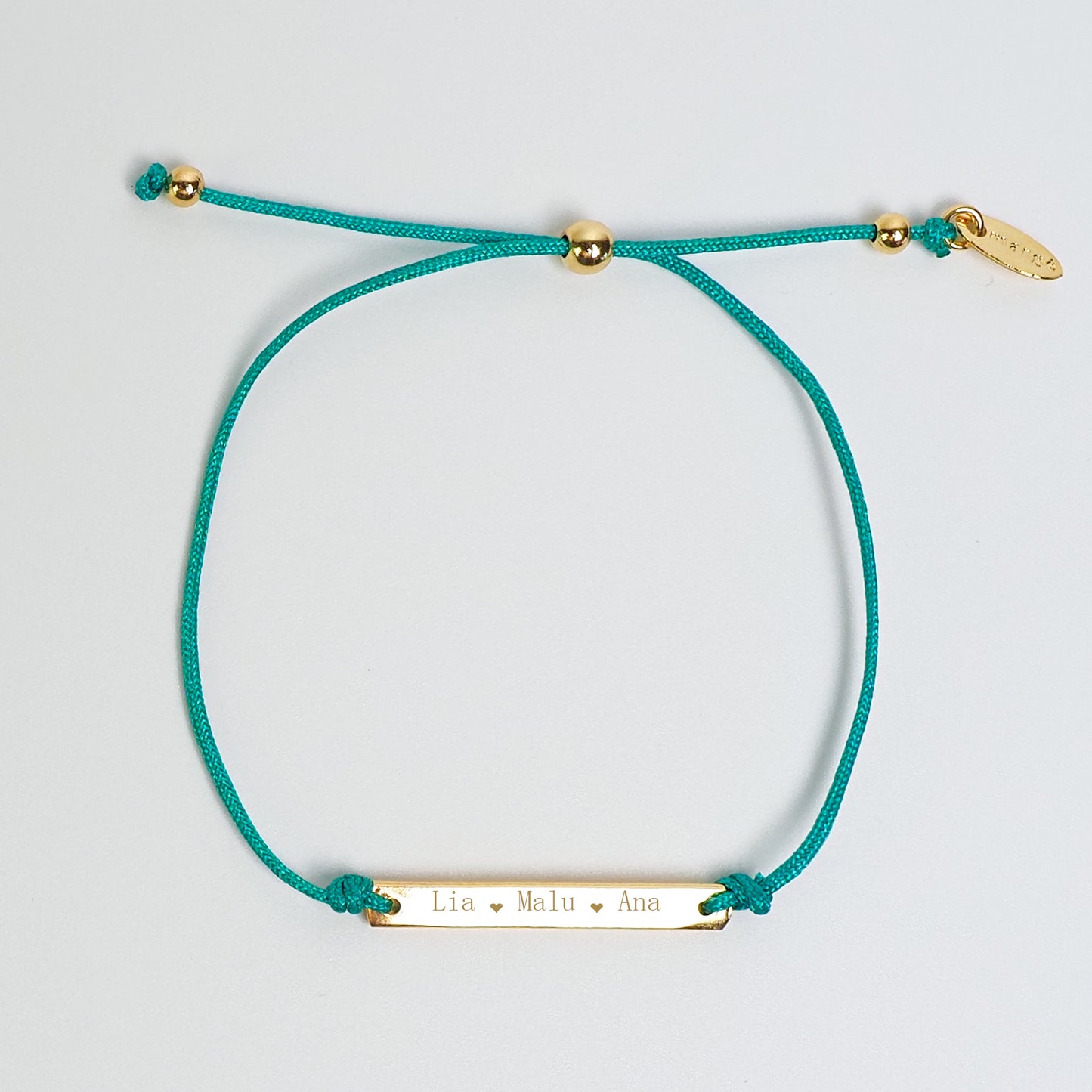 Pulseira inicial plaquinha turquesa dourada - margê atelier