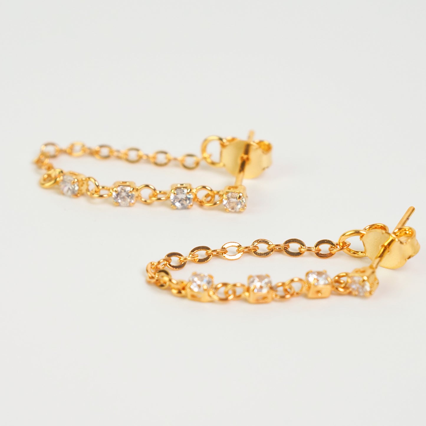 Brinco corrente 4 zirconias dourado - margê atelier
