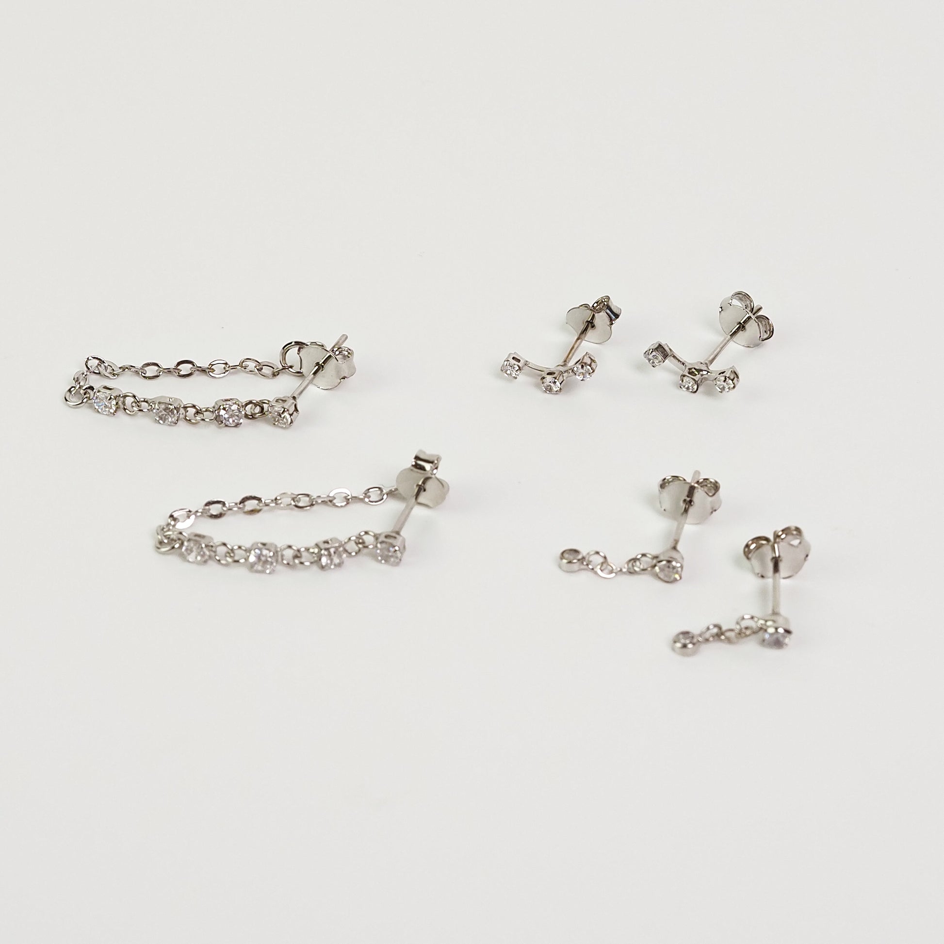 Brinco corrente 4 zirconias prateado - margê atelier