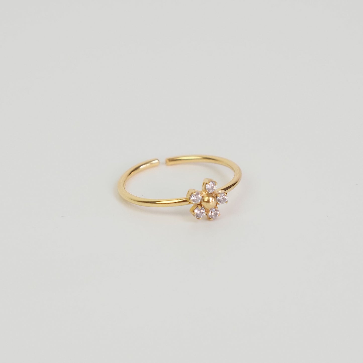 Anel flor zirconia dourado
