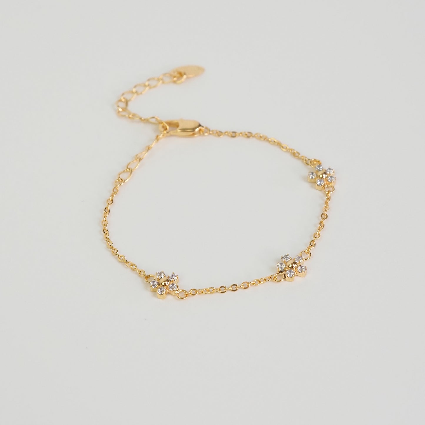 Pulseira flor zirconia dourado