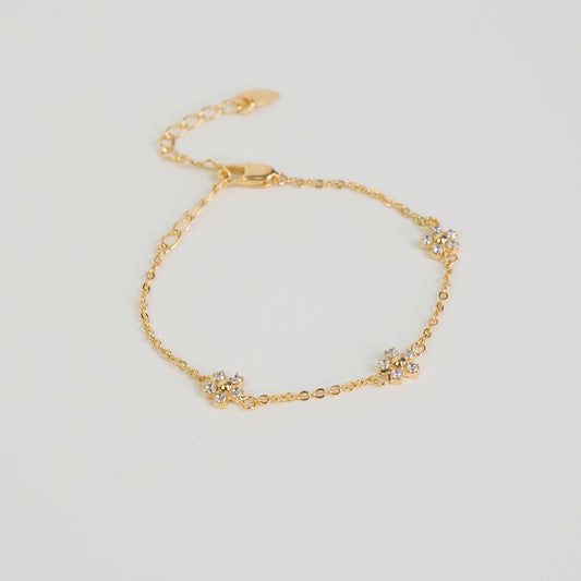 Pulseira flor zirconia dourado