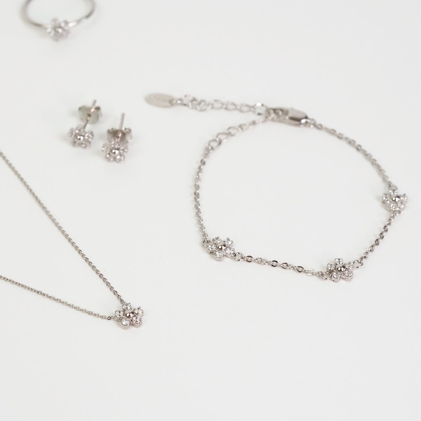 Pulseira flor zirconia prateada