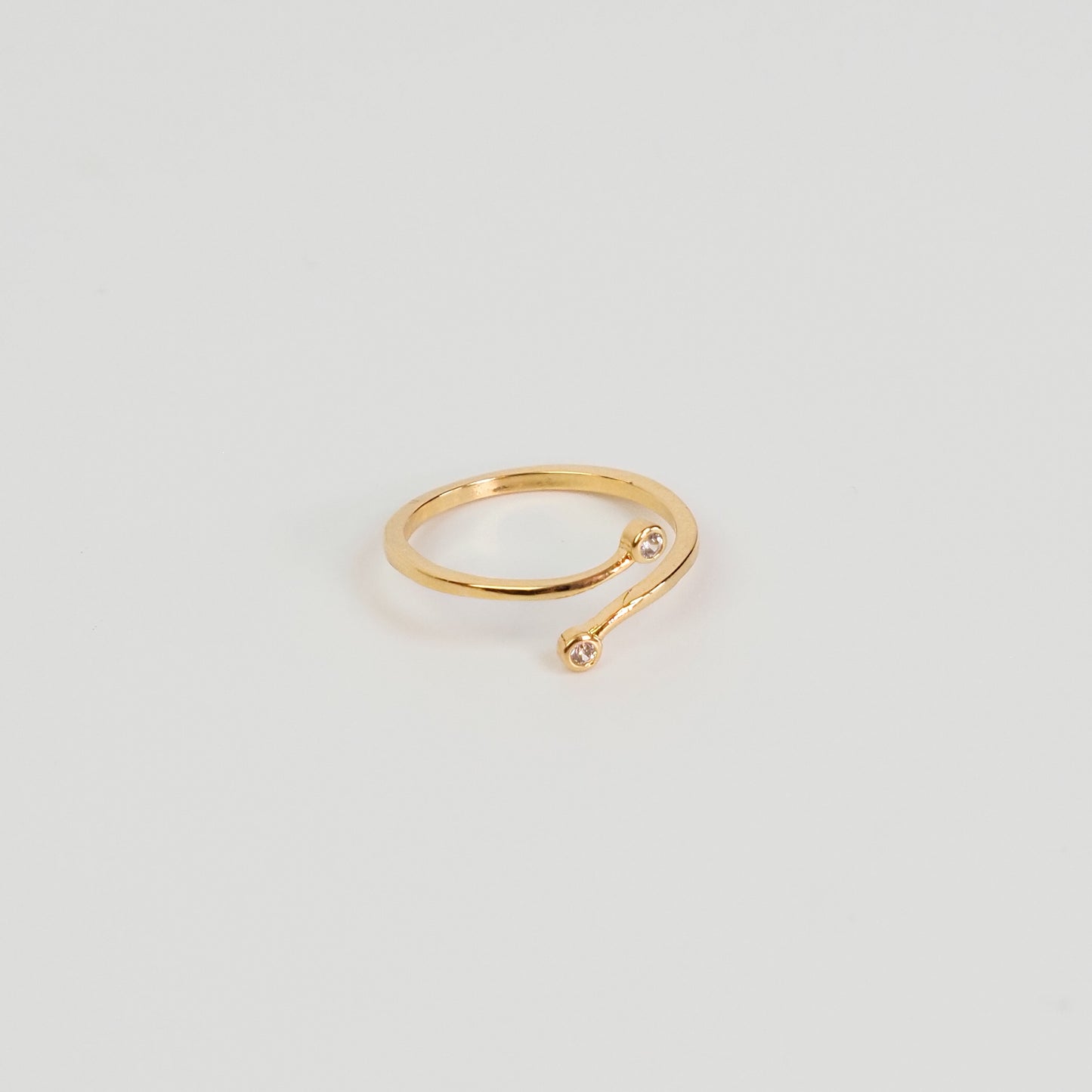 Anel duas zirconias ajustável dourado