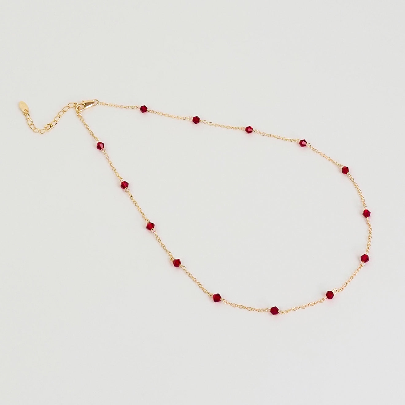 Colar pedrinhas vermelhas dourado
