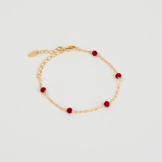 Pulseira pedrinhas vermelhas dourado