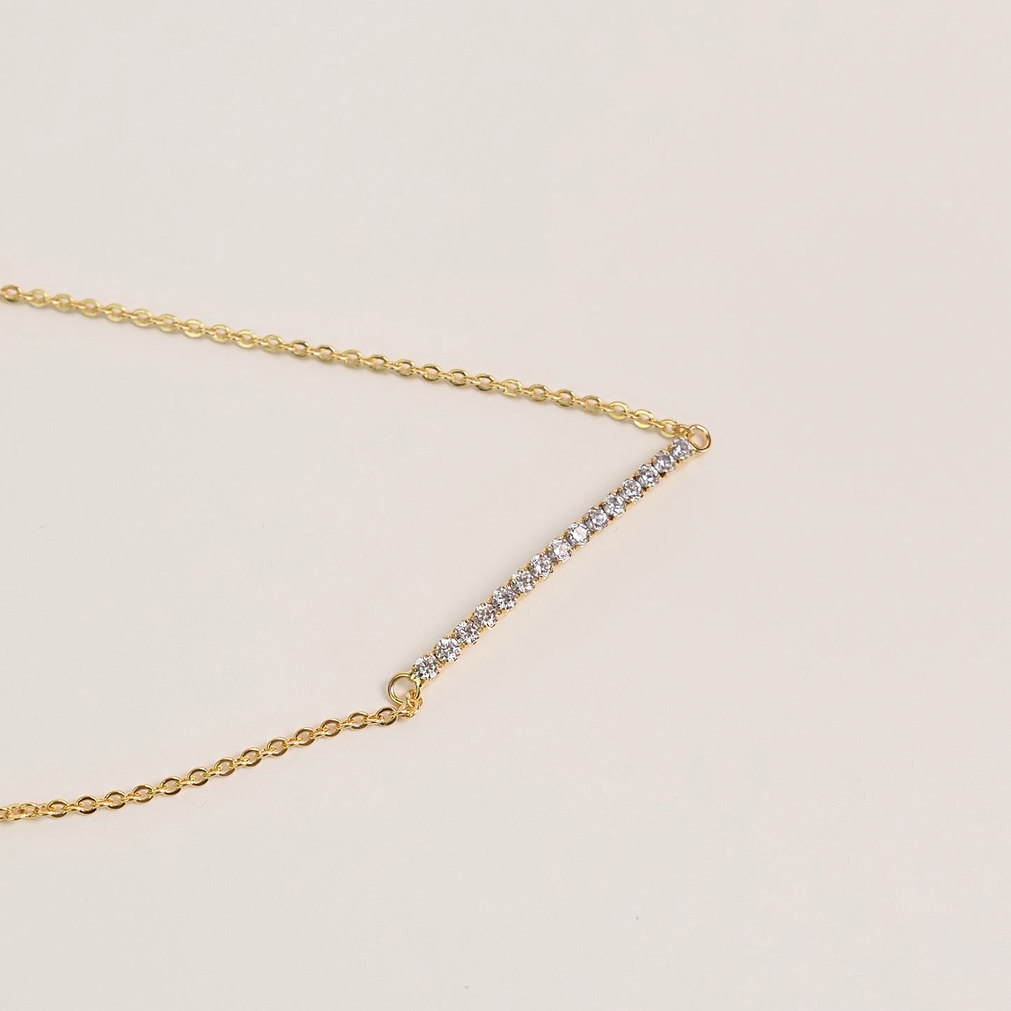 Pulseira arco zirconia dourado