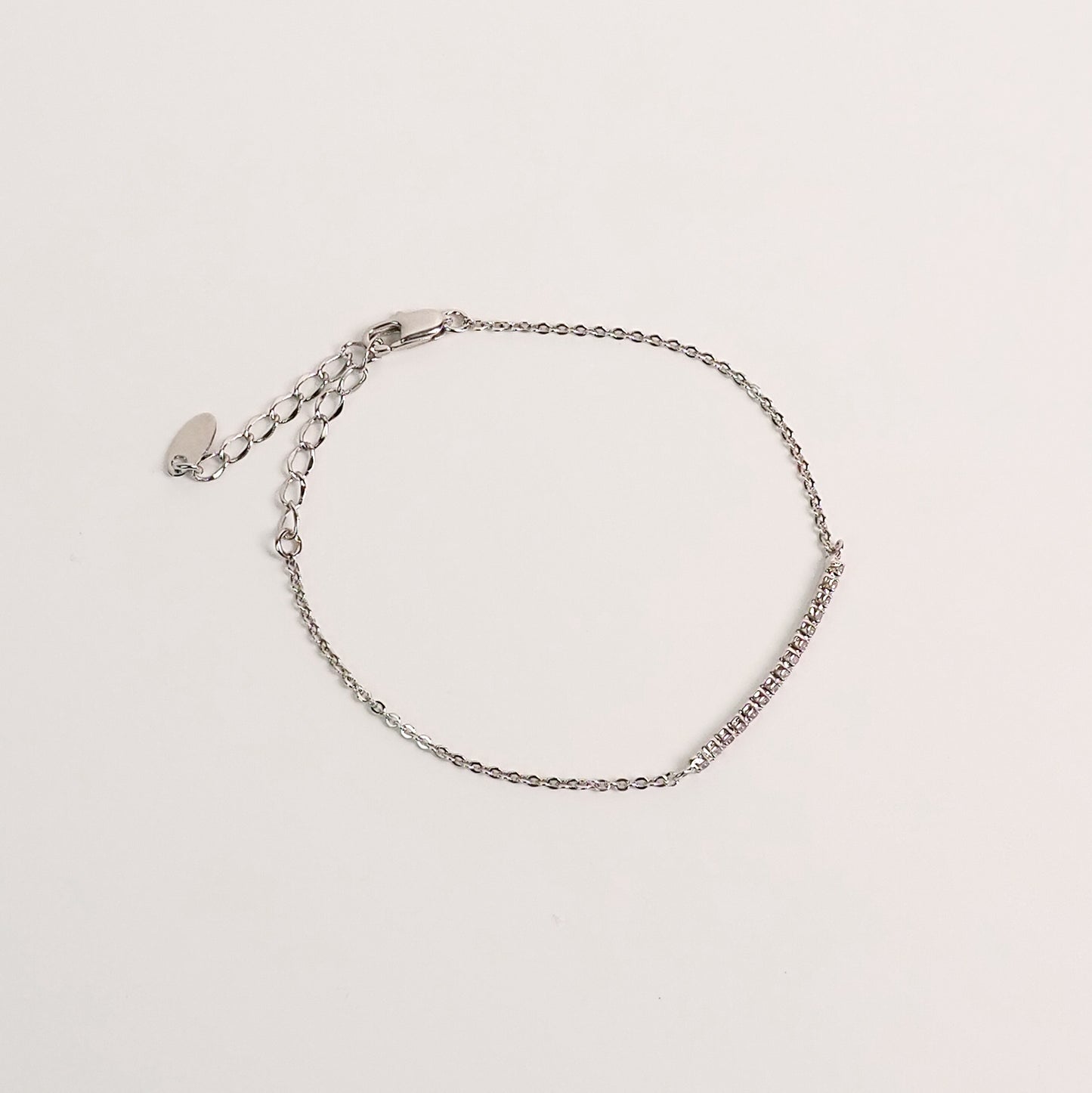 Pulseira arco zirconia prateada