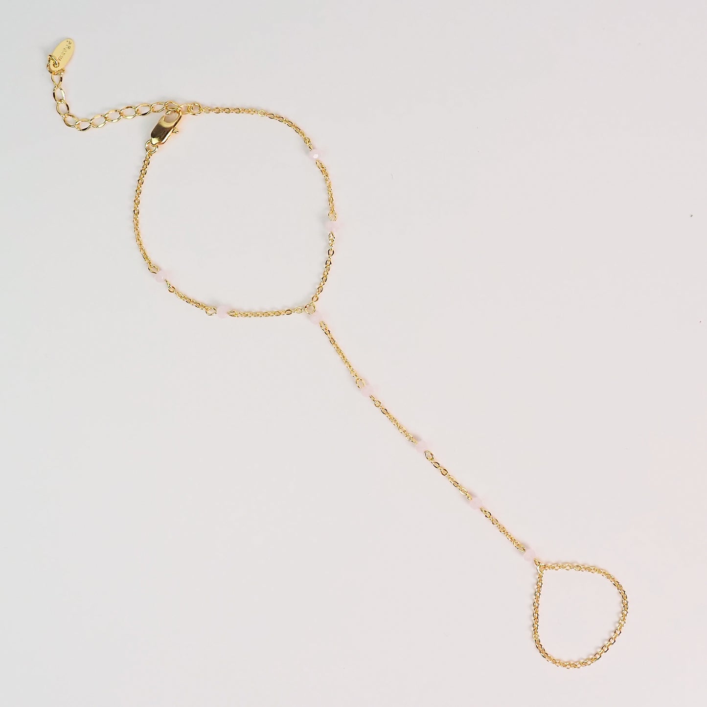 Handchain pedrinhas rosa dourado
