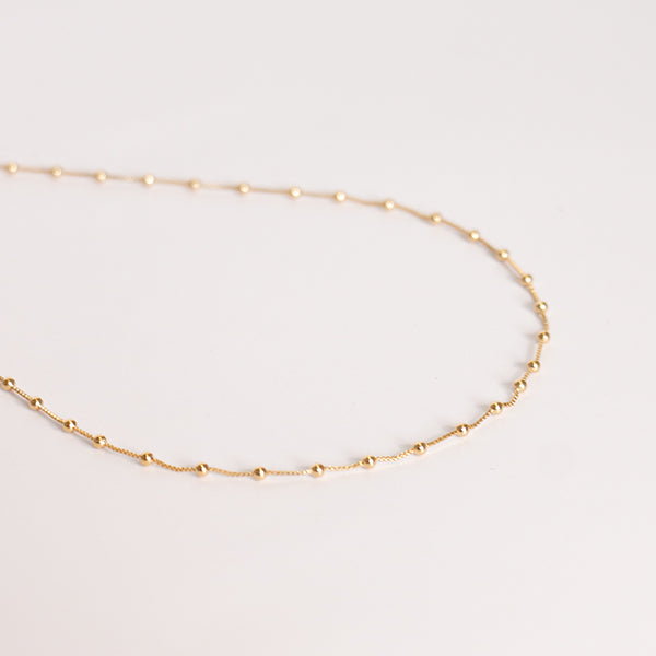 Choker bolinhas dourado